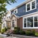 Queens home exterior with new white replacement windows and clean trim